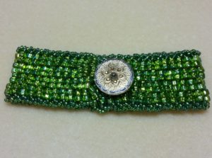 Artisan Peyote Green Bracelet. Beadweaving with decorative button and handsewn beautifully detailed closure handmade by Andrea Horowitz of Andrea Sherry Creations.