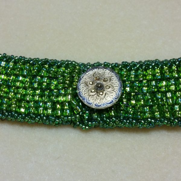 Artisan Peyote Green Bracelet. Beadweaving with decorative button and handsewn beautifully detailed closure handmade by Andrea Horowitz of Andrea Sherry Creations.